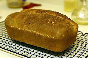 A finished loaf of sandwich bread